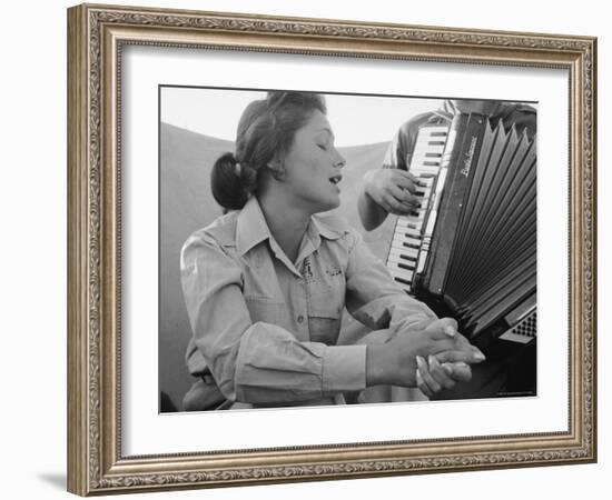 Young Israeli Woman Singing While Accompanied by Someone Playing an Accordion-Paul Schutzer-Framed Photographic Print