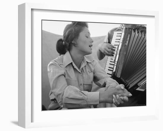 Young Israeli Woman Singing While Accompanied by Someone Playing an Accordion-Paul Schutzer-Framed Photographic Print