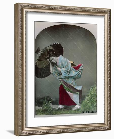 Young Japanese Girl in the Rain, c.1900-Japanese Photographer-Framed Photographic Print