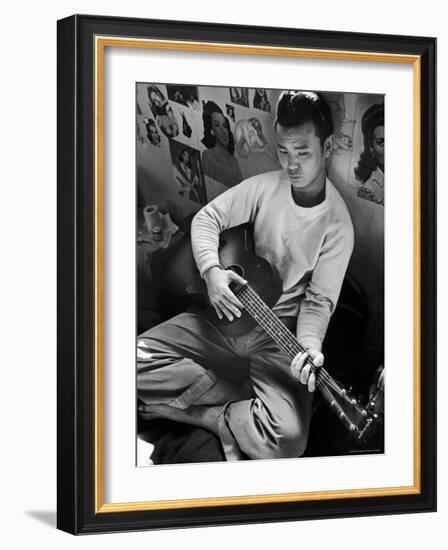 Young Japanese Nisei Playing Guitar in the Stockade at Tule Lake Segregation Center-Carl Mydans-Framed Photographic Print