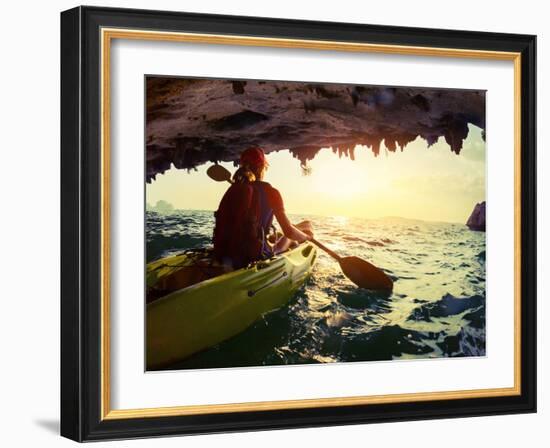 Young Lady Paddling the Kayak from Limestone Cave towards Open Sea-Dudarev Mikhail-Framed Photographic Print