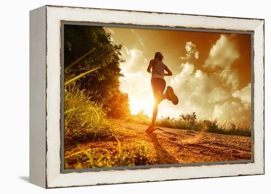 Young Lady Running on a Rural Road during Sunset-Dudarev Mikhail-Framed Premier Image Canvas