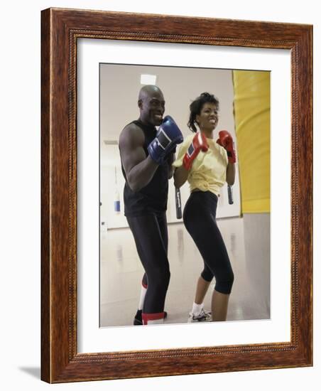 Young Male Coach Coaching a Female Boxer-null-Framed Photographic Print