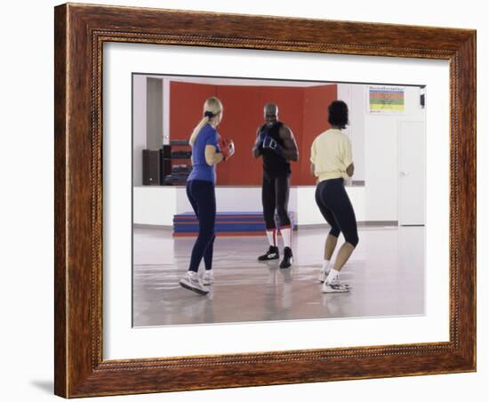 Young Male Coach Coaching Two Female Boxers-null-Framed Photographic Print