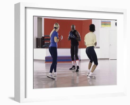 Young Male Coach Coaching Two Female Boxers-null-Framed Photographic Print