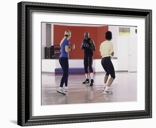 Young Male Coach Coaching Two Female Boxers-null-Framed Photographic Print