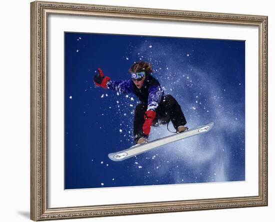 Young Male Snowboarder in Action-null-Framed Photographic Print