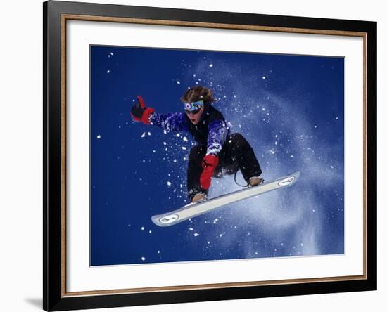 Young Male Snowboarder in Action-null-Framed Photographic Print