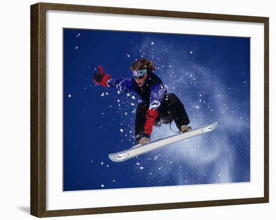 Young Male Snowboarder in Action-null-Framed Photographic Print