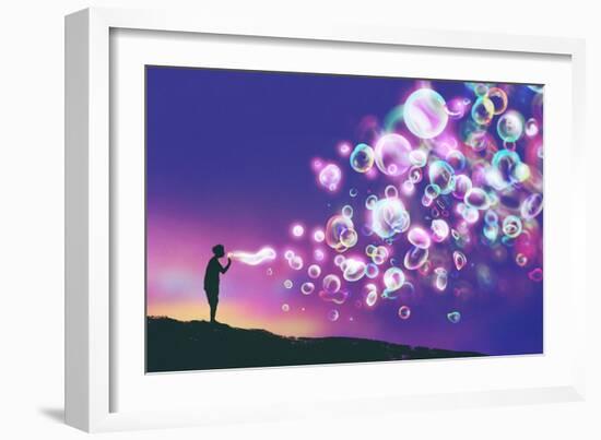 Young Man Blowing Glowing Soap Bubbles against Evening Sky,Illustration Painting-Tithi Luadthong-Framed Art Print