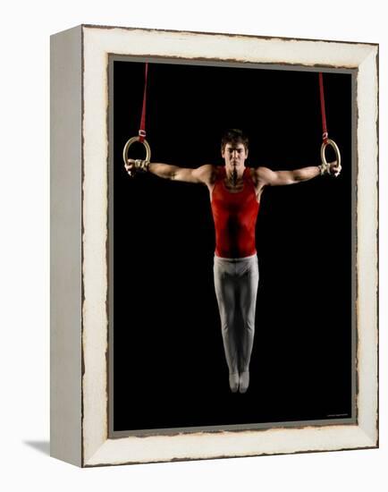 Young Man Exercising on Gymnastic Rings, Bainbridge Island, Washington State, USA-null-Framed Premier Image Canvas