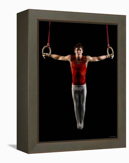 Young Man Exercising on Gymnastic Rings, Bainbridge Island, Washington State, USA-null-Framed Premier Image Canvas