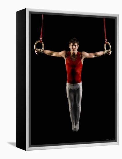 Young Man Exercising on Gymnastic Rings, Bainbridge Island, Washington State, USA-null-Framed Premier Image Canvas