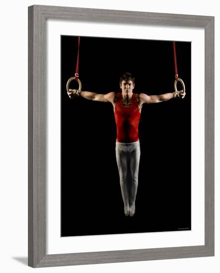 Young Man Exercising on Gymnastic Rings, Bainbridge Island, Washington State, USA-null-Framed Photographic Print