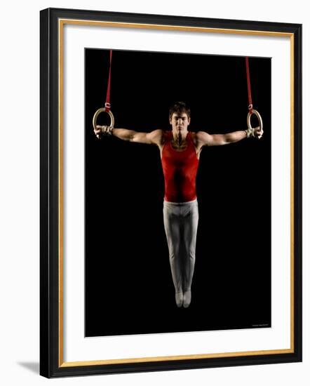 Young Man Exercising on Gymnastic Rings, Bainbridge Island, Washington State, USA-null-Framed Photographic Print