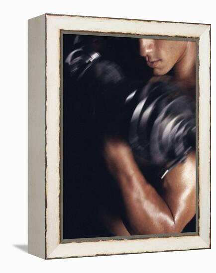 Young Man Exercising with Dumbbells-null-Framed Premier Image Canvas