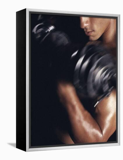 Young Man Exercising with Dumbbells-null-Framed Premier Image Canvas