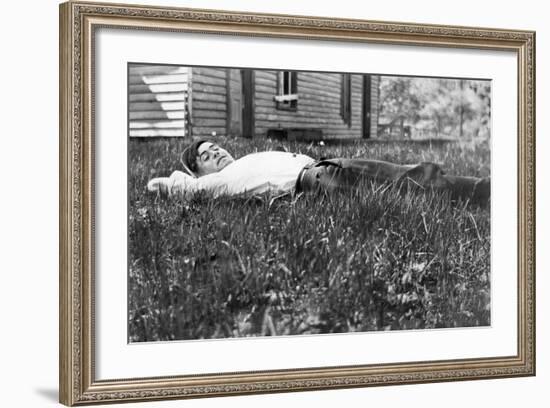 Young Man Lays in the Grass, Ca. 1912-null-Framed Photographic Print