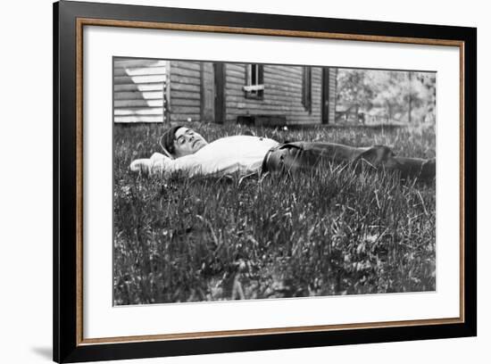 Young Man Lays in the Grass, Ca. 1912-null-Framed Photographic Print