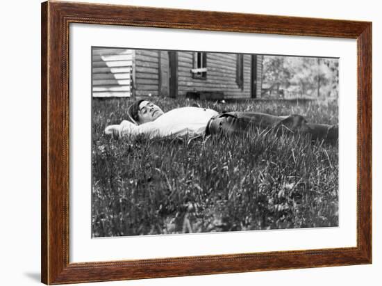 Young Man Lays in the Grass, Ca. 1912-null-Framed Photographic Print