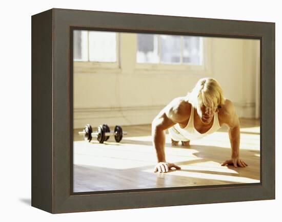 Young Man Preforming Push Up Exercise in Gym, New York, New York, USA-Chris Trotman-Framed Premier Image Canvas