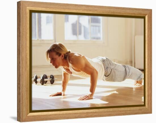 Young Man Preforming Push Up Exercise in Gym, New York, New York, USA-Chris Trotman-Framed Premier Image Canvas