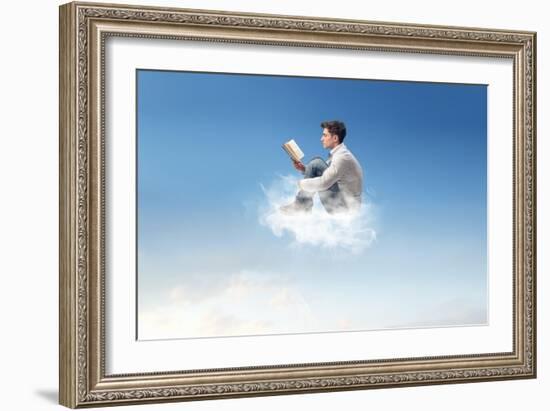 Young Man Reads Sitting On A Cloud-olly2-Framed Art Print