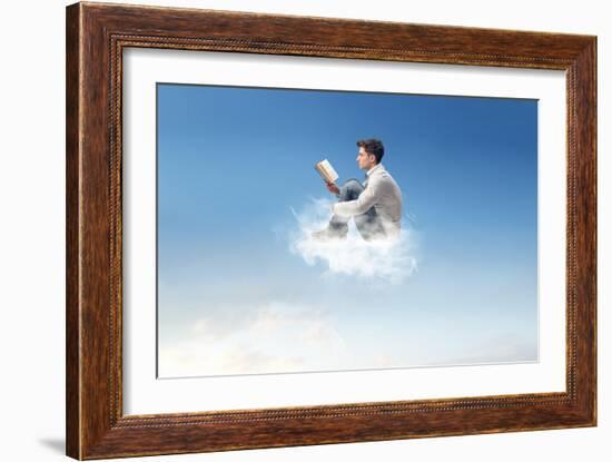 Young Man Reads Sitting On A Cloud-olly2-Framed Art Print