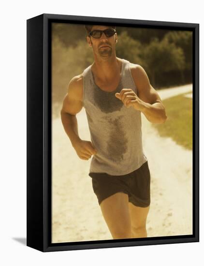 Young Man Running on the Beach-null-Framed Premier Image Canvas