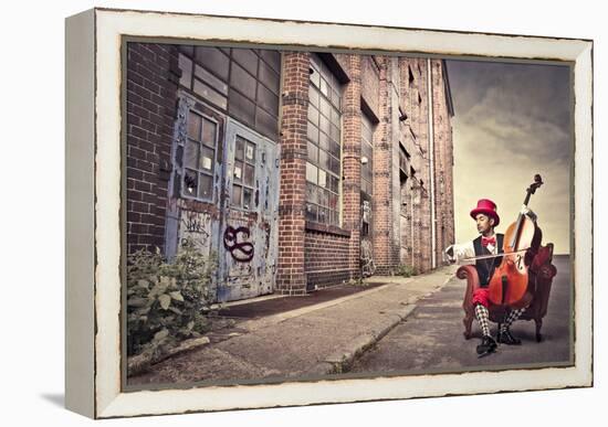 Young Man Sitting On An Armchair On A City Street And Playing The Cello-olly2-Framed Stretched Canvas