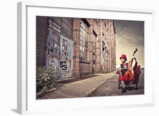 Young Man Sitting On An Armchair On A City Street And Playing The Cello-olly2-Framed Art Print