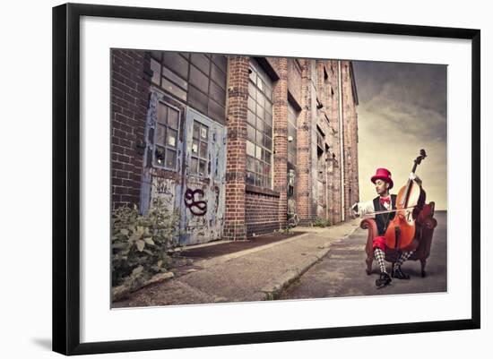 Young Man Sitting On An Armchair On A City Street And Playing The Cello-olly2-Framed Art Print