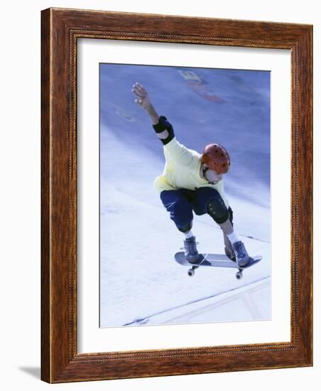 Young Man Skateboarding in Mid Air-null-Framed Photographic Print