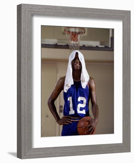 Young Man Standing Holding a Basketball with a Towel on His Head-null-Framed Photographic Print