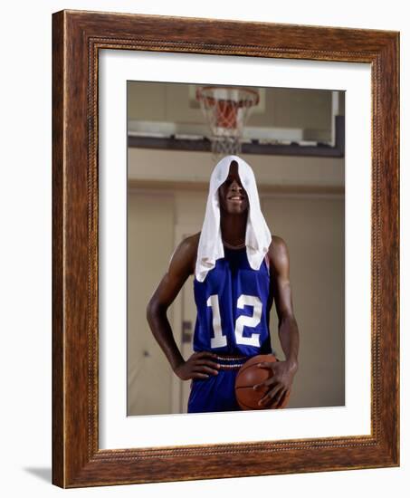 Young Man Standing Holding a Basketball with a Towel on His Head-null-Framed Photographic Print