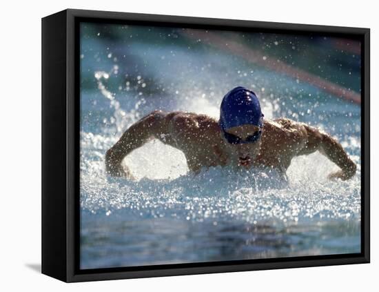 Young Man Swimming the Butterfly Stroke-null-Framed Premier Image Canvas