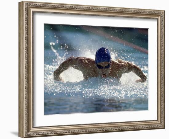 Young Man Swimming the Butterfly Stroke-null-Framed Photographic Print