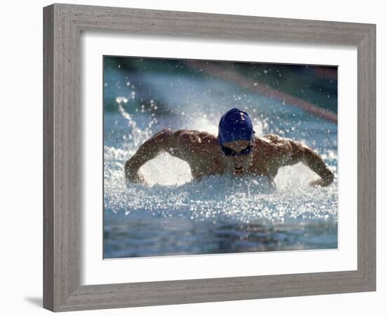 Young Man Swimming the Butterfly Stroke-null-Framed Photographic Print