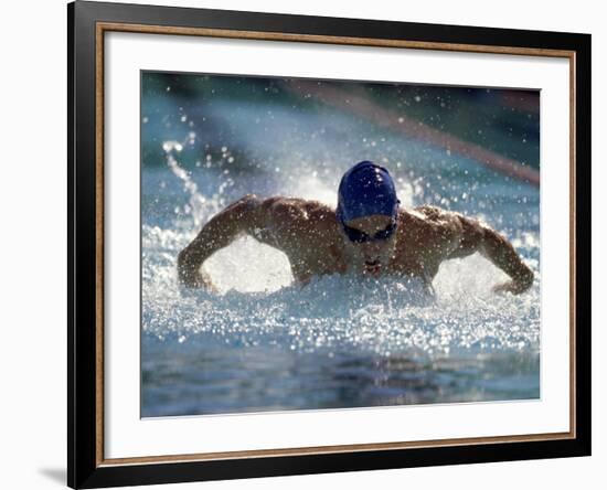 Young Man Swimming the Butterfly Stroke-null-Framed Photographic Print