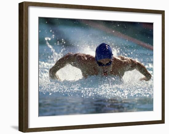 Young Man Swimming the Butterfly Stroke-null-Framed Photographic Print