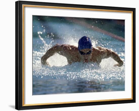 Young Man Swimming the Butterfly Stroke-null-Framed Photographic Print