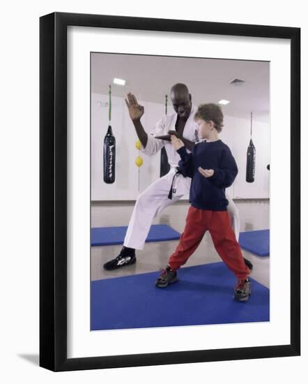 Young Man Teaching a Boy Martial Arts-null-Framed Photographic Print