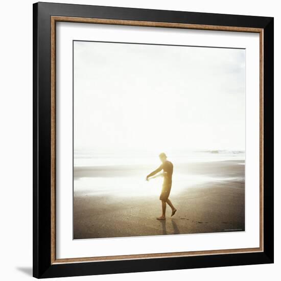 Young Man Waxes His Board Before Entering Marabella's Waves, Costa Rica, Central America-Aaron McCoy-Framed Photographic Print