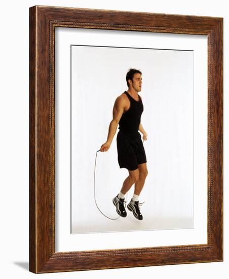Young Man Working Out with Jump Rope-Chris Trotman-Framed Photographic Print