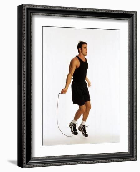 Young Man Working Out with Jump Rope-Chris Trotman-Framed Photographic Print