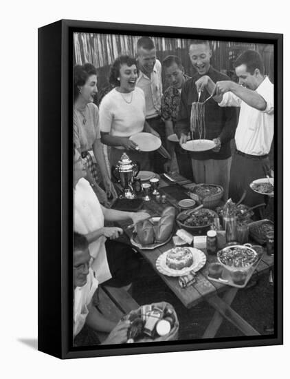 Young Married Couples Enjoying a Backyard Buffet Feast , Featuring Spaghetti-Nina Leen-Framed Premier Image Canvas