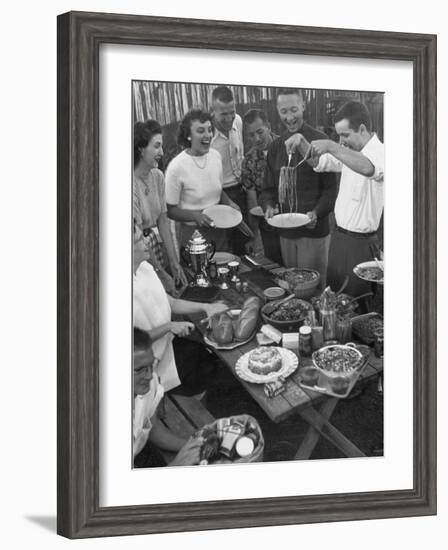 Young Married Couples Enjoying a Backyard Buffet Feast , Featuring Spaghetti-Nina Leen-Framed Photographic Print