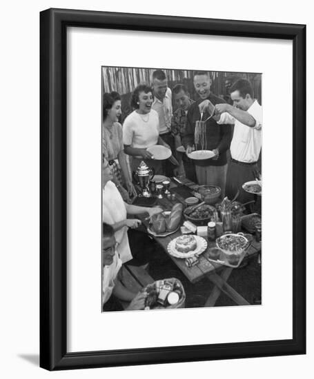 Young Married Couples Enjoying a Backyard Buffet Feast , Featuring Spaghetti-Nina Leen-Framed Photographic Print