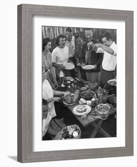 Young Married Couples Enjoying a Backyard Buffet Feast , Featuring Spaghetti-Nina Leen-Framed Photographic Print