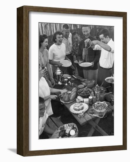 Young Married Couples Enjoying a Backyard Buffet Feast , Featuring Spaghetti-Nina Leen-Framed Photographic Print